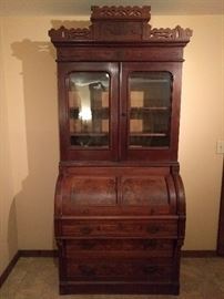 Victorian burled walnut secretary, with wavy glass front.