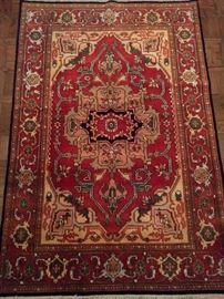 Vintage hand woven Persian design Heriz rug, 100% wool face, measures 4' x 6' 1".