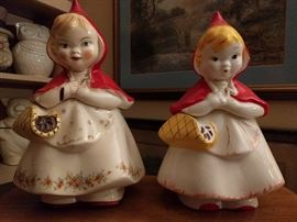 Sibling rivalry Little Red Riding Hood cookie jars, one by McCoy, the other by Hull, #967.