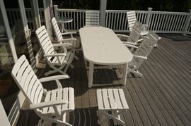 Kettler (Germany) patio furniture set, including extension table and seven Tiffany model armchairs and two ottomans, all with custom cushions, $1,500/set.