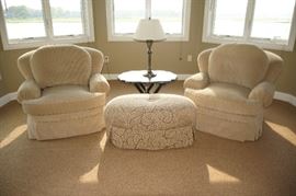 Lounge set,
including two upholstered armchairs,
and ottoman, marked Owners Select,
North Carolina, $1,200/set.