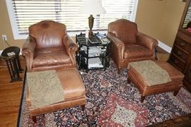Pair modern, brown leather
armchairs with ottomans, marked
Century, Hickory, NC, $800/pair.