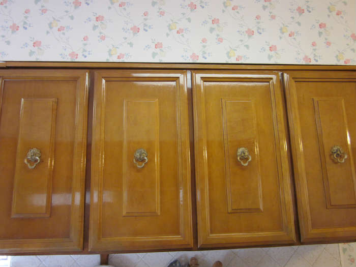 1950's Glossy Wood Cabinetry. Think it's Maple, not sure. Must be removed by you. Can be discussed at sale.