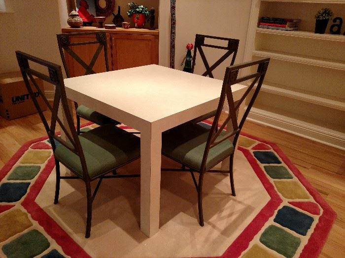 Contemporary game table and chairs on octagonal rug