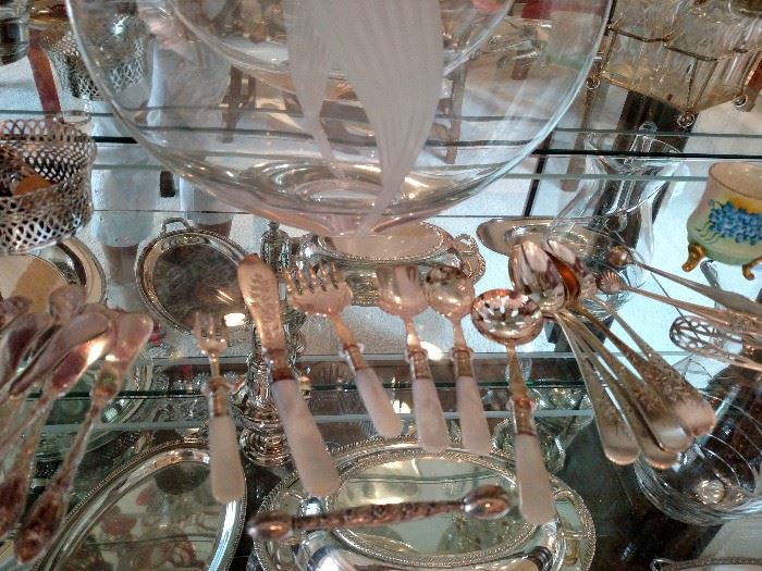 Mother of pearl handle flatware and sterling spoons