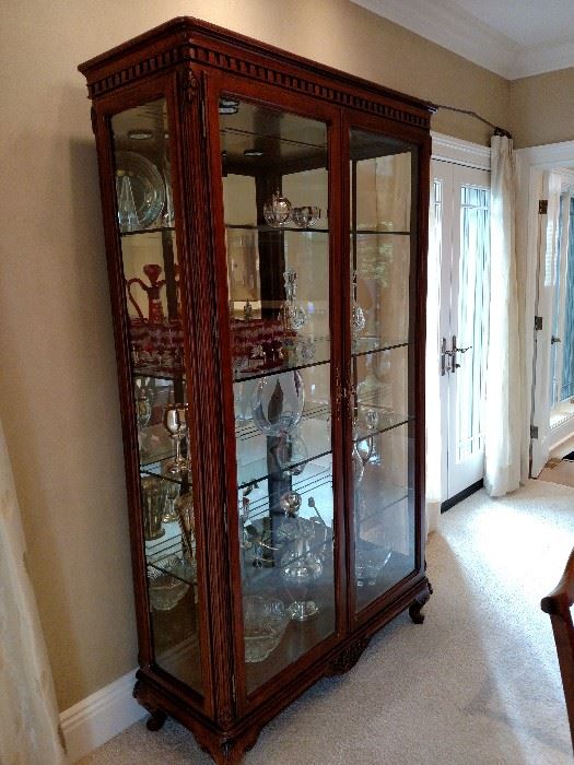 Glass and mahogany lighted display cabinet