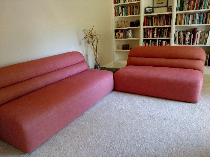 Pink armless sofa and loveseat