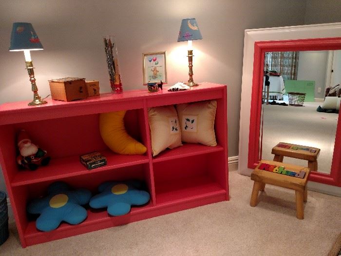 Pink painted bookcase with companion mirror and children's toys, etc.
