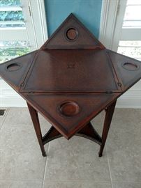 Mahogany game table with the top opened