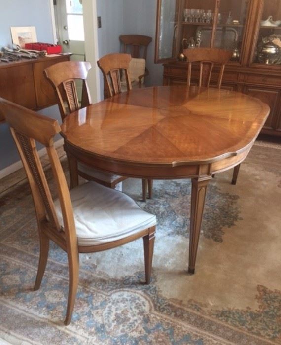 the dining room set is in very good condition / the rug is room size - in good condition but needs cleaning