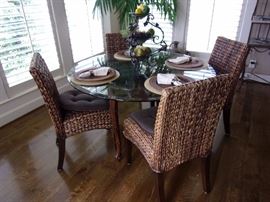 Glass top round kitchen table with 4 Pottery Barn SEAGRASS SIDE CHAIR - New $159.00. Incredibly durable, renewable, and rich in tonal variation, seagrass and abaca bring relaxed style to the dining room.
HOW IT'S CONSTRUCTED
Made of kiln-dried solid wood frame.
Solidly constructed using mortise-and-tenon joinery and corner blocks for exceptional stability.
Honey finish is woven of seagrass with honey stained legs.
Havana Dark is woven of abaca with mahogany stained legs.
DETAILS YOU'LL APPRECIATE
Natural seagrass has a subtle fragrance similar to hay and other grass varieties; this scent will dissipate over time.
Color variations are inherent in the natural plant fibers used in our seagrass collection. The result may be differences in color tone from that shown.
Sealed with two coats of clear lacquer for moisture resistance.