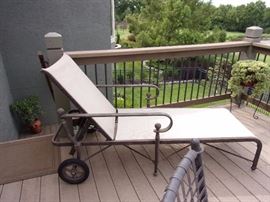 One of two patio lounge chairs