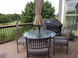 Patio table with four chairs, umbrella, base and cushions! Great condition!