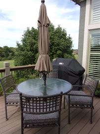Patio table with four chairs, umbrella, base and cushions! Great condition!