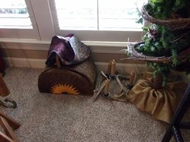 Lighted Christmas tree with bear hugging and owl at top.Picnic basket