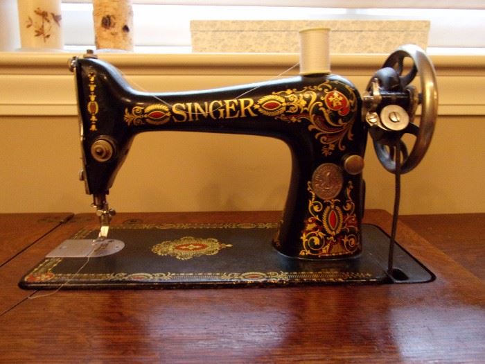 Singer 66 Red Eye Treadle Sewing Machine & Cabinet 
Antique Early 1900's beautiful graphics