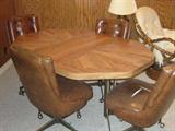 Table with leaf and 4 chairs on rollers