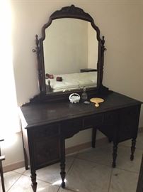 Antique vanity matches the  antique bedroom set.