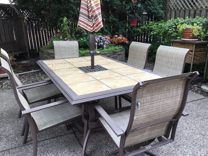 Large outdoor patio table, six chairs and umbrella