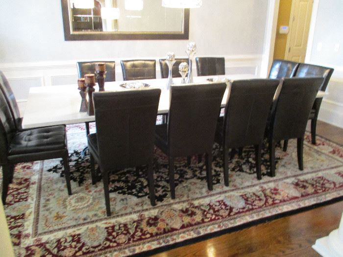 Quartz Table with Black Leather Chairs