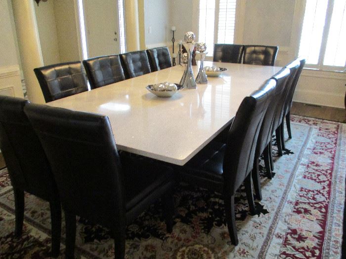 Quartz Table Top and Black Leather Chairs