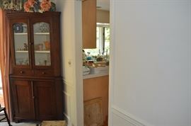American walnut corner cupboard upper section with two glass paneled doors and two small drawers and lower section having two wood paneled doors bracket feet circa 1860-1870