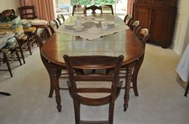 American Victorian walnut 5 leg drop leaf extension table with five leaves circa 1860-1870, American Victorian side chairs with cane seats and turned legs, circa 1865-1975