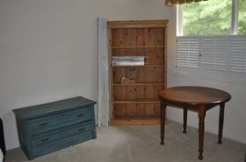Blue painted American oak chest of two long drawers circa 1890-1895, tall light pine English open bookcase, American Victorian round walnut table on four turned legs 36” diameter circa 1860-1870 