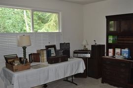 Assorted photo frames, Eddie Bauer turned lamp with shade, photo albums, Kodascope Kodak Eight Model 70 movie projector, vintage movie screen, Sansui 4 channel receiver QRX-6500, speakers, Riverside Furniture Corp. EHO Home Office 3-piece corner unit with glass front doors, shelves, file cabinet, CPU cabinet, corner and cabinet hutch