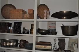 Baskets, brass antique grocer’s oval scoop for candy scale, brass bucket with bail handle antique, books, wooden antique cheese boxes, brass, vintage Minolta camera, Kodak No. 2 folding Brownie, Autographic antique camera, cat figurine, King Charles' spaniel