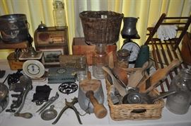 Antique bicycle basket, advertising tins, vintage canning jars, old kitchen utensils, aluminum pitcher, vintage scales, white gloves worn in 1950s marching band, antique butter press, enamelware, antique slaw cutter, desk bell vintage, antique meat grinder, old school bell, small pine spice chests, primitive sugar bucket Firkin, copper and brass pots and buckets, old milking stool