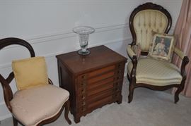 American walnut side chair with upholstered seat, American walnut spool cabinet of six drawers original brasses circa 1875-1885, American Victorian walnut gentlemen’s open arm chair fruit and nut carved motif upholstered in yellow floral brocade fabric with tufted back circa 1860-1870