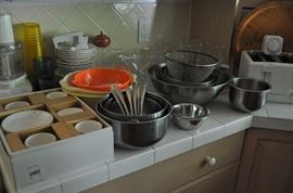 Set of dessert plates and cups, mixer, stainless steel bowls, colanders, white plates, strainers, wine glasses, toaster