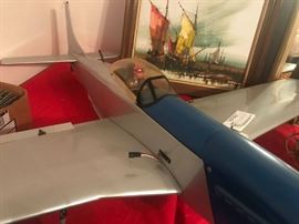 #92 Blue/silver gas powered model plane w/pilot 50x52x12 $300
