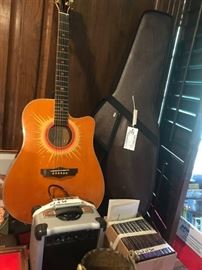 #64 G=1- small amp Esteban w/ sun cut away guitar limited edition, $150