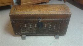 VERY UNIQUE!!! Antique studded Leather Trunk. has a design on lid