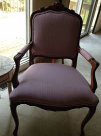 Rose colored carved arm chair