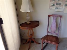 beautiful oval Harp table and caned antique sewing rocker