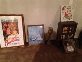 pictures, candle holders, small cupboard