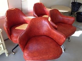 4 mid century modern orange vinyl with casters