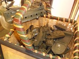 Plastic army toy tanks, jeeps, and trucks