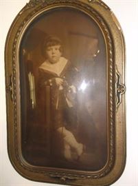 Convex framed portrait of little boy