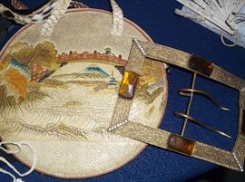 Tooled leather handbag and huge belt buckle