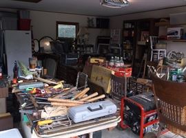 Garage full w/upright freezer, generator, slat/spindle back chairs, tools, etc.
