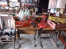 Antique school desks, Coca-Cola and Pepsi crates
