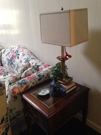 One of two matching leather top end tables