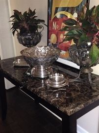 Marble top table; large silver plate bowl; live plants