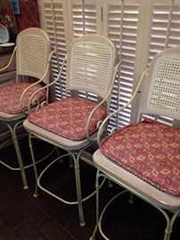 Three of the four matching bar stools