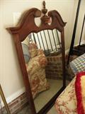Mahogany mirror with finial.