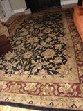 12 x 15 wool rug in black, rust and gold.